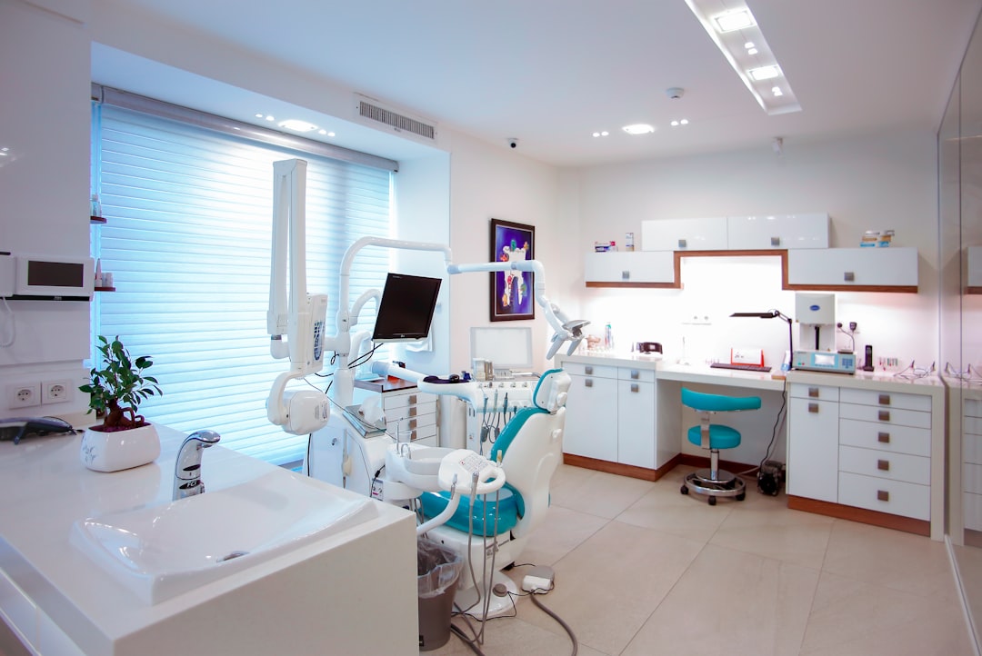 A modern dental clinic interior with equipment and furniture